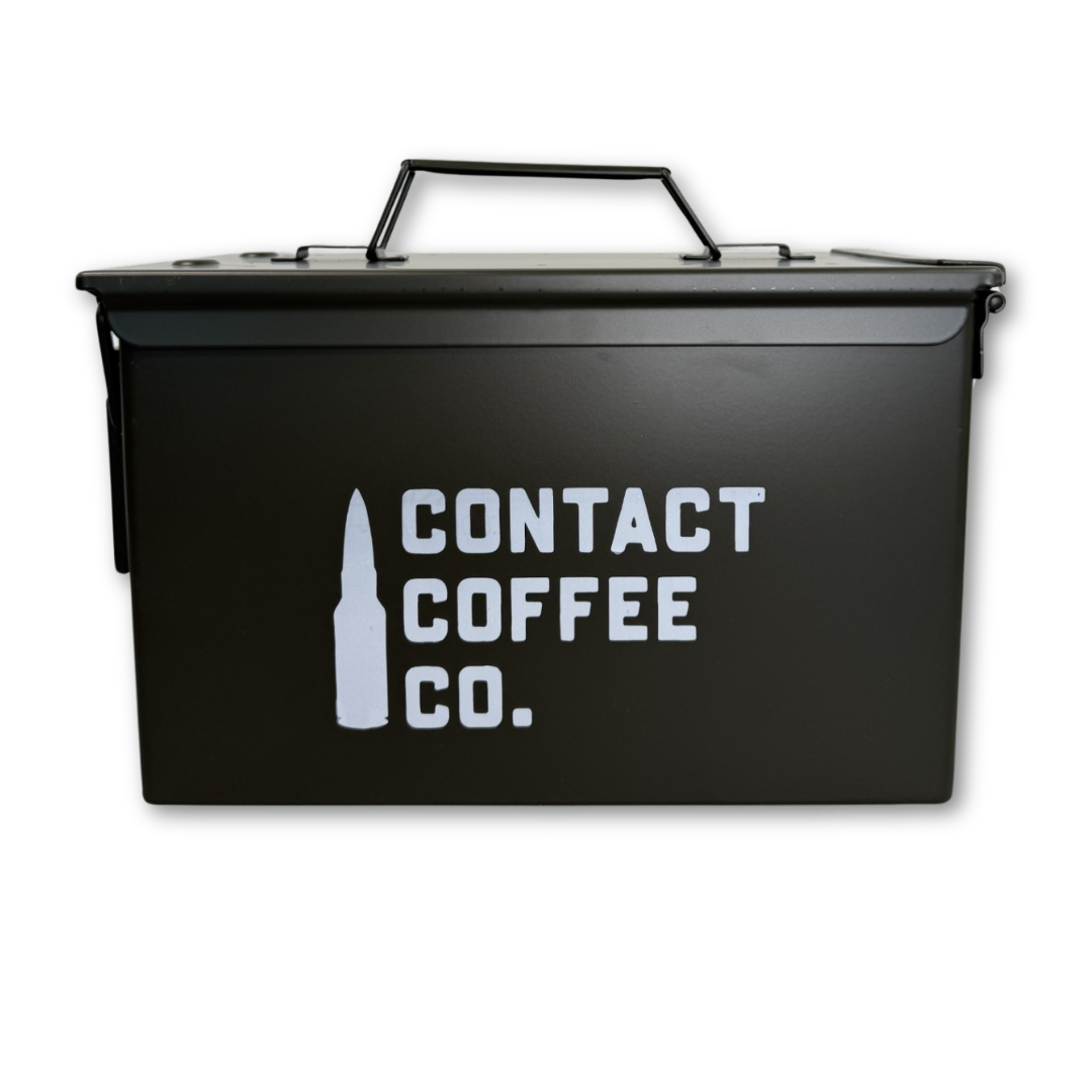 Genuine M2A1 50 cal steel ammo tin in olive green with Contact Coffee Co stencil