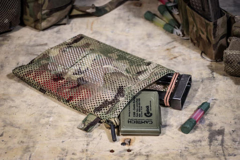 Military kit packed into a multicam stash bag, the kind of personal admin item worth bringing on the Royal Marines kit list